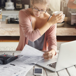 business woman owner cheering that they have reduced their business debt