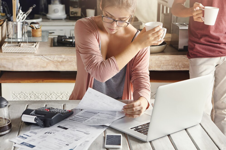 business woman owner cheering that they have reduced their business debt